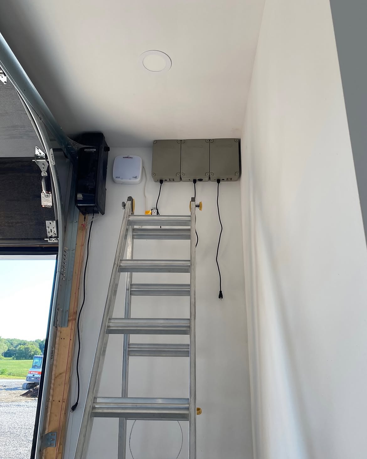Lighting controller boxes mounted inside a garage