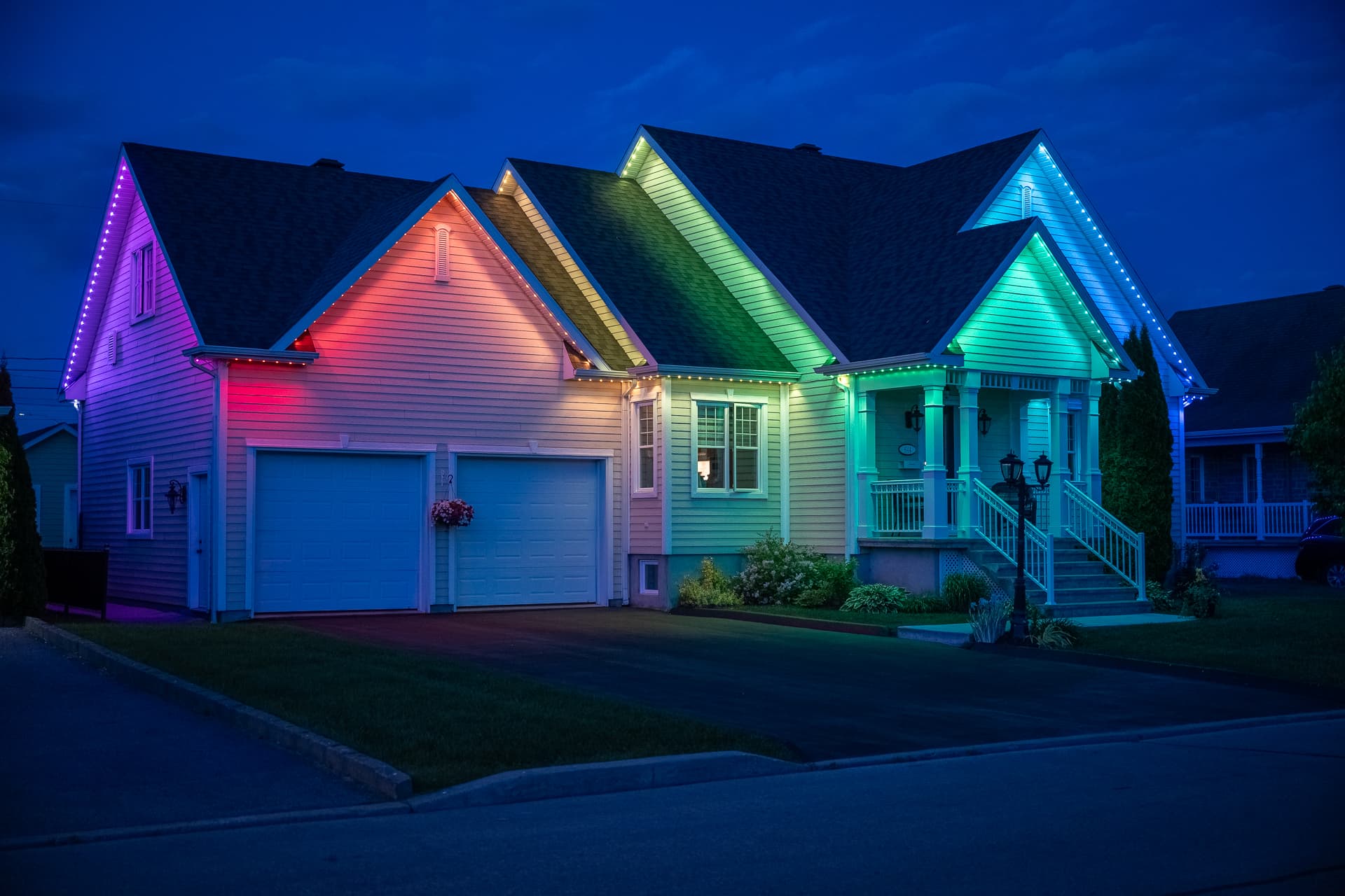 Home illuminated with a rainbow permanent lighting scene